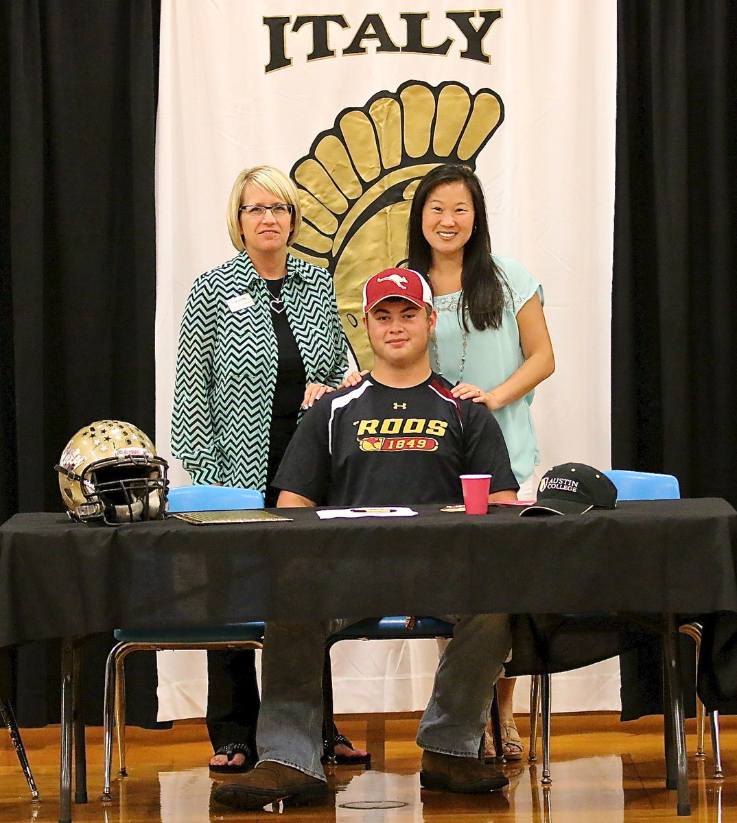 Image: Behind every great Gladiator is a faculty and staff that go the extra mile. Lisa Jacinto and Nicole Tindol where just two of many who assisted Zain along his journey to play football at the next level.