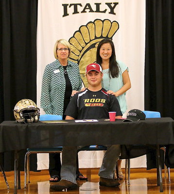 Image: Behind every great Gladiator is a faculty and staff that go the extra mile. Lisa Jacinto and Nicole Tindol where just two of many who assisted Zain along his journey to play football at the next level.