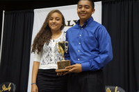 Image: Chris Munoz is the 2014 recipient of the Margaret Oliphant Cup, presented by Vanessa Cantu, 2013 recipient.
