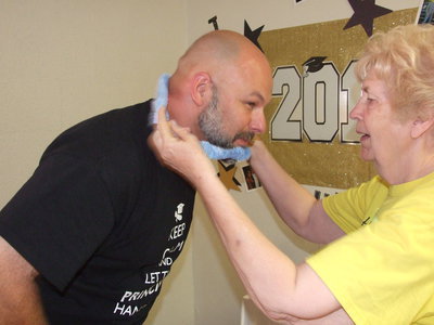 Image: Miss Birdie welcomes Principal Joffre with a Hawaiian lei.
