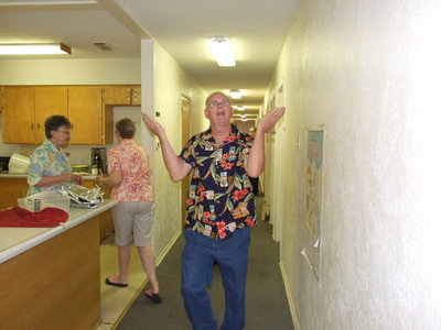 Image: Pastor Ronnie Dabney welcomes everyone to the luau.