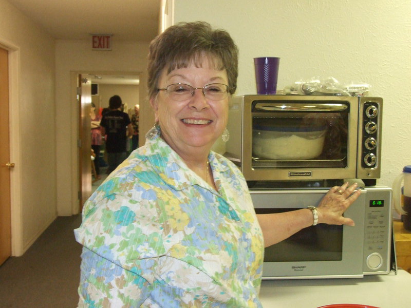 Image: Martha Norcross helps deliver the food.