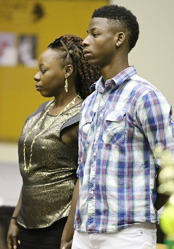 Image: In recognition of Italy’s 2013-2014 senior student-athletes, Eric Carson is introduced while being escorted by his mother.