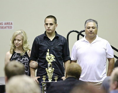 Image: In recognition of Italy’s 2013-2014 senior student-athletes, Cody Medrano is introduced while being escorted by his parents.