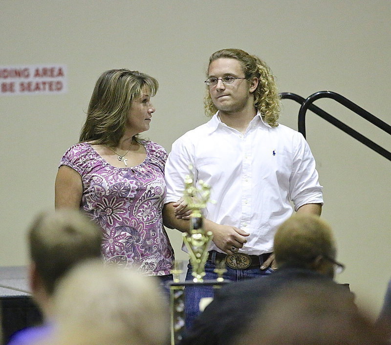 Image: In recognition of Italy’s 2013-2014 senior student-athletes, Shadrach Newman is introduced while being escorted by his mother.