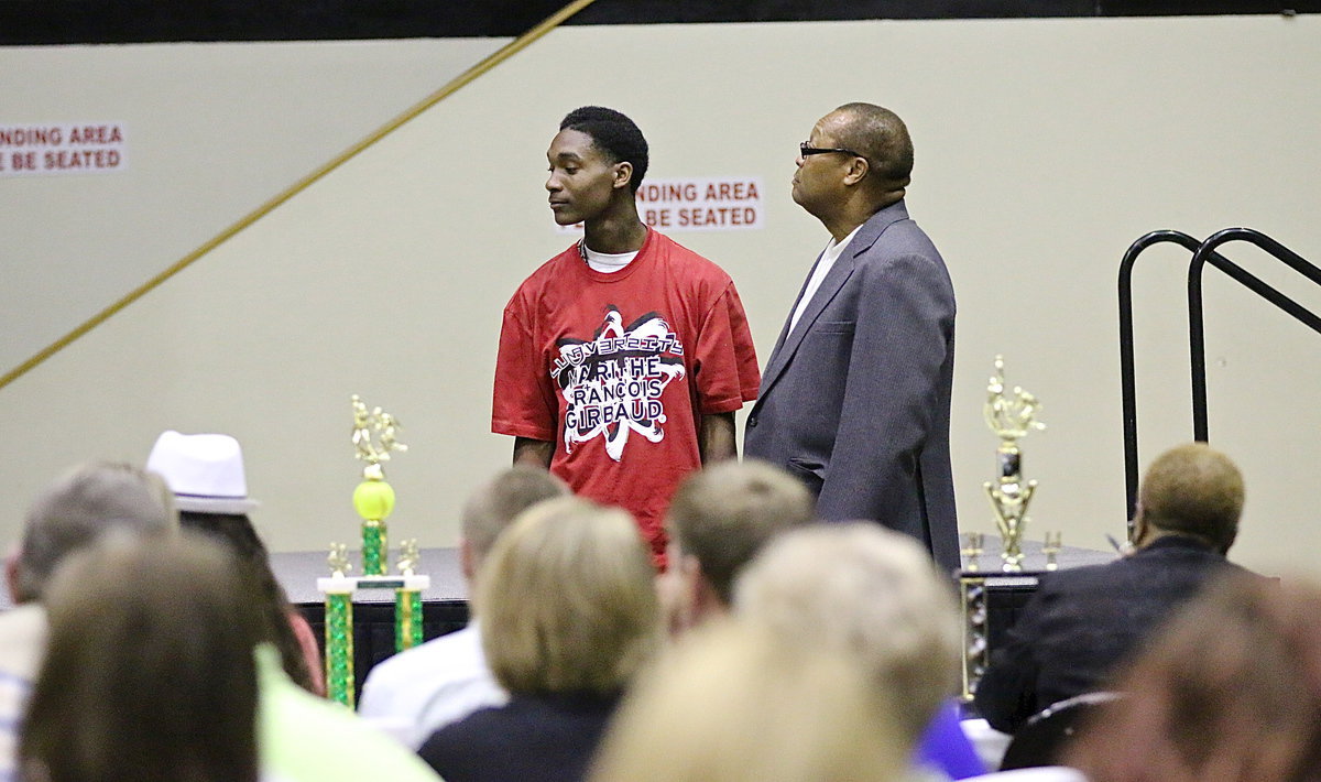 Image: In recognition of Italy’s 2013-2014 senior student-athletes, Trevon Robertson is introduced while being escorted by Larry Mayberry, Sr.
