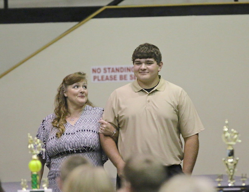 Image: In recognition of Italy’s 2013-2014 senior student-athletes, Kevin Roldan is introduced while being escorted by his mother.
