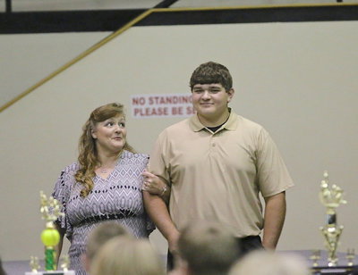 Image: In recognition of Italy’s 2013-2014 senior student-athletes, Kevin Roldan is introduced while being escorted by his mother.