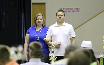 Image: In recognition of Italy’s 2013-2014 senior student-athletes, Bailey Walton is introduced while being escorted by his mother.