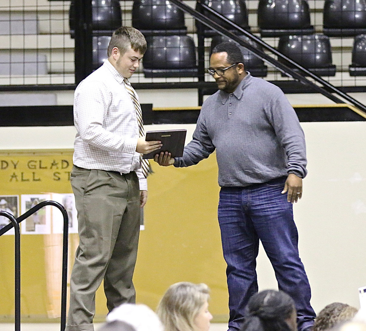 Image: In honor of his uncle, David Henderson presents the 2013-2014 David Henderson Scholarship to Zain Byers.