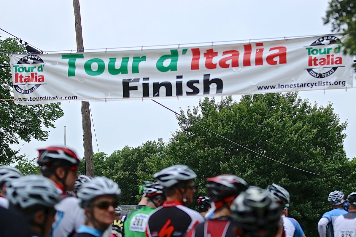 Image: Cyclists gather at the corner of College and Park Street in Italy for the start of the Tour d’Italia bike ride that offers many routes thru Ellis, Navarro and Hill counties before returning to Italy to cross the finish line.
