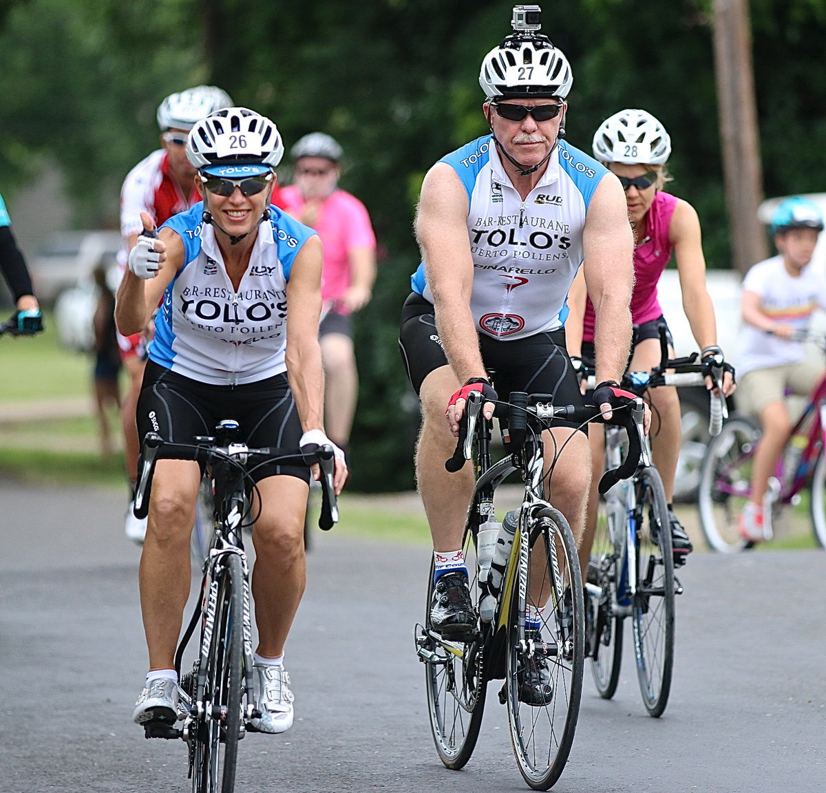 Image: And another thumbs up as riders continue to roll thru the starting line.