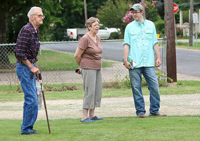 Image: Don Riddle, Linda Goodman and Pastor Joseph Barrett enjoy watching the Tour d’Italia participants peddle past.