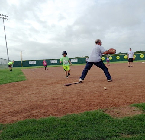 Image: Gladiator Baseball Coach Jackie Cate tries to make a stop at the plate.
