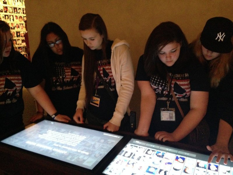 Image: Amber Hooker and Sarah Burrow navigate through the interactive database of 9/11 victims at the 9/11 museum.