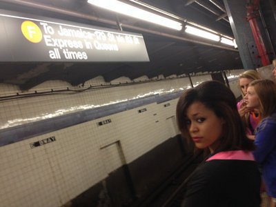 Image: Alex Minton waits for the Uptown F train with some fellow bandmates.