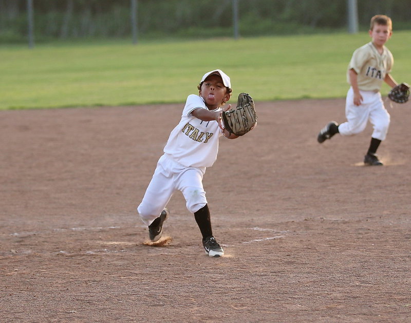 Image: Pitcher Cason Green(10) attempts to pull in a popup with one eye closed and a mouth full of dust.