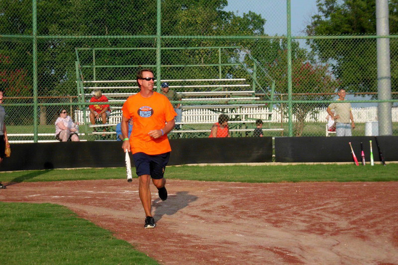 Image: Charles Hyles shows the crowd how to get a base hit.