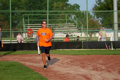 Image: Charles Hyles shows the crowd how to get a base hit.