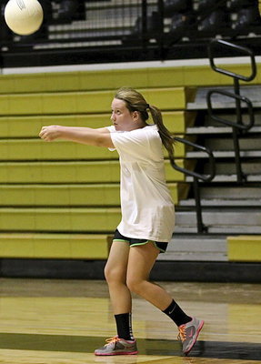 Image: Rachael Huskins returns the ball as Italy’s volleyball ladies give it their all during drills.