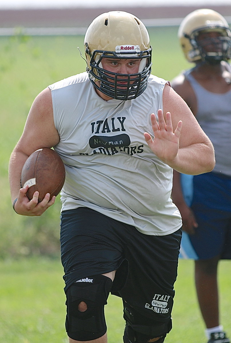 Image: And we will end this segment with an opponent haunting action shot of senior Colin Newman as he rumbles toward a district title.