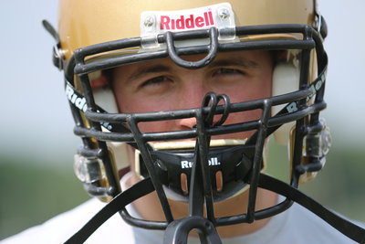 Image: Austin Crawford has a vision after tying a rope around his waist and dragging a tractor tire behind him as he ran this summer.