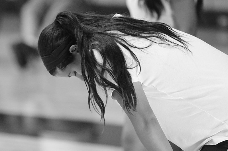 Image: Freshman Jenna Holden pushes herself during two-a-day workouts inside the Coliseum.