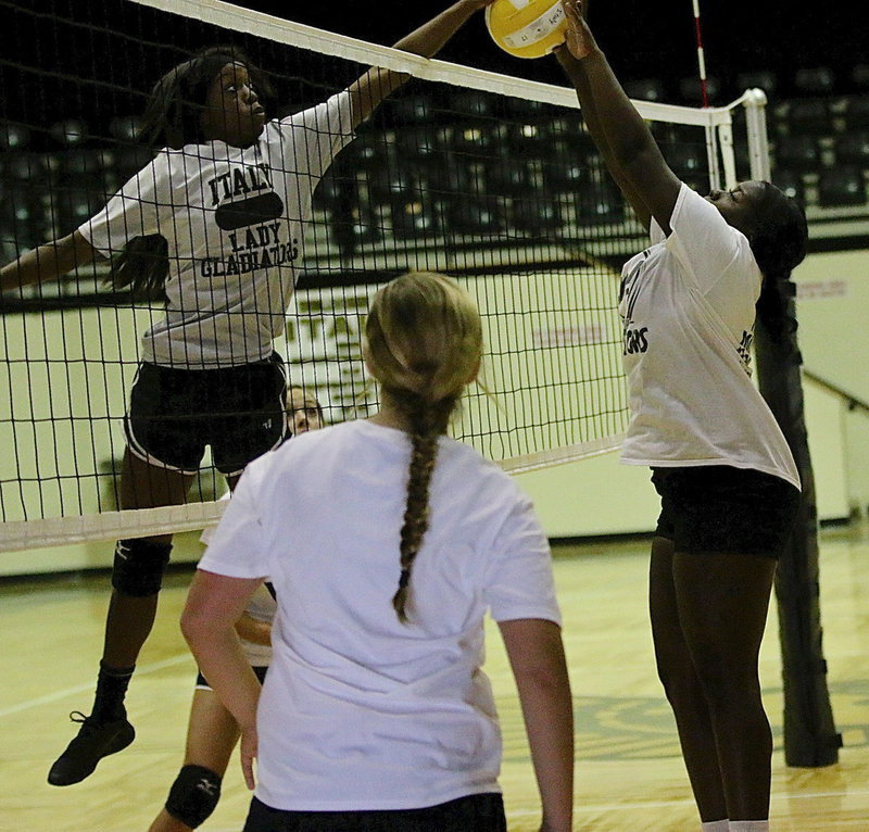 Image: Senior Kortnei Johnson jousts with teammate Taleyia Wilson.