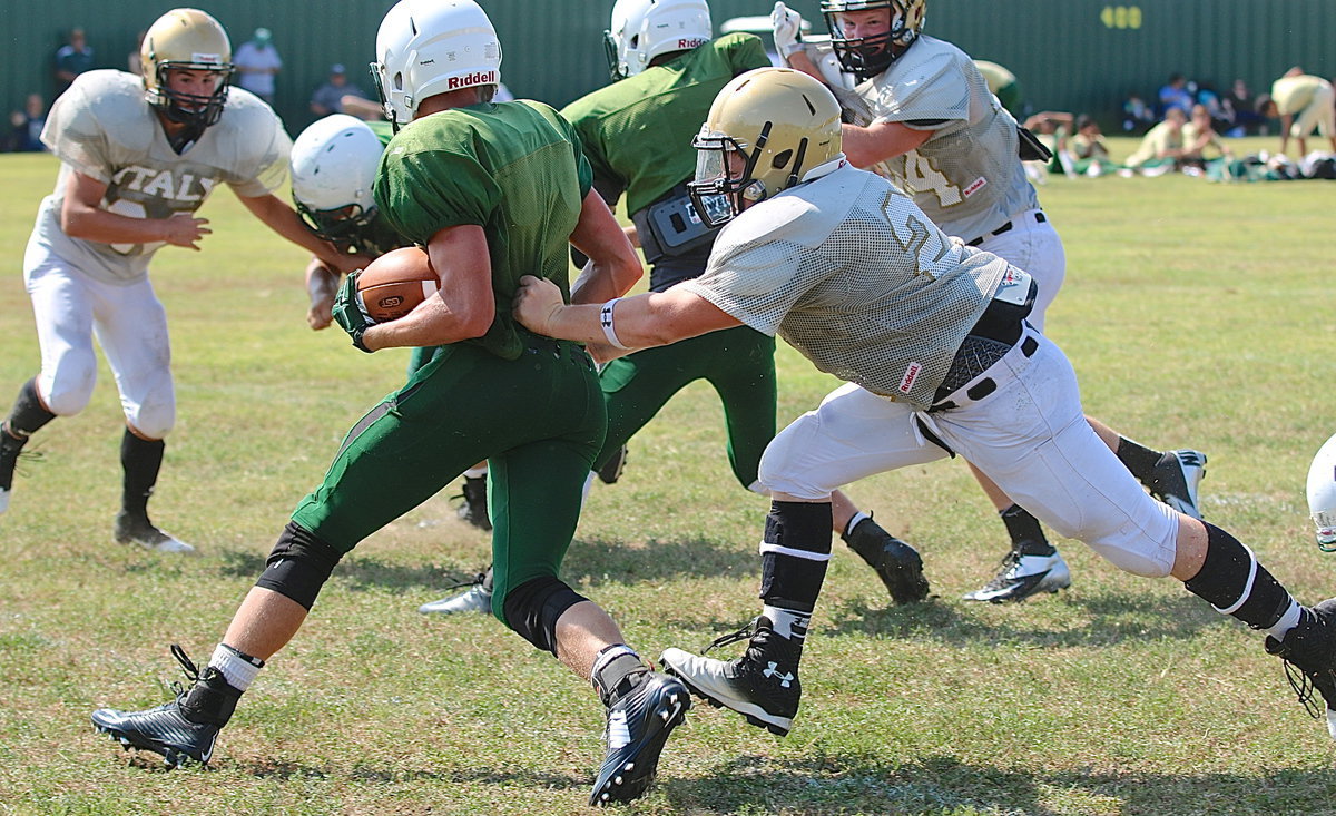 Image: Gladiator defensive tackle John Escamilla(21) goes after a ball carrier in the Eagle backfield.