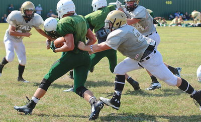 Image: Gladiator defensive tackle John Escamilla(21) goes after a ball carrier in the Eagle backfield.