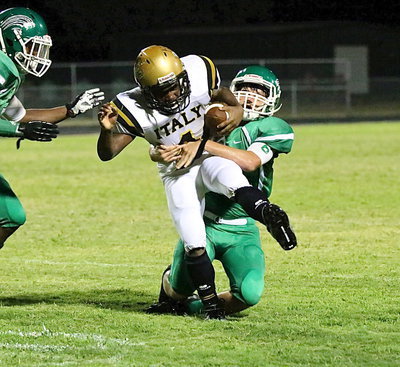 Image: Gladiator freshman Kendrick Norwood(4) fights for extra yards against the Kerens’ defense. Norwood had 6 carries for 31 yards.