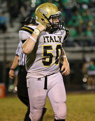 Image: Superhuman John Escamilla(50) blocked 3 point after kicks by the Bobcats. The third block was nullified by an offsides penalty charged to Italy.