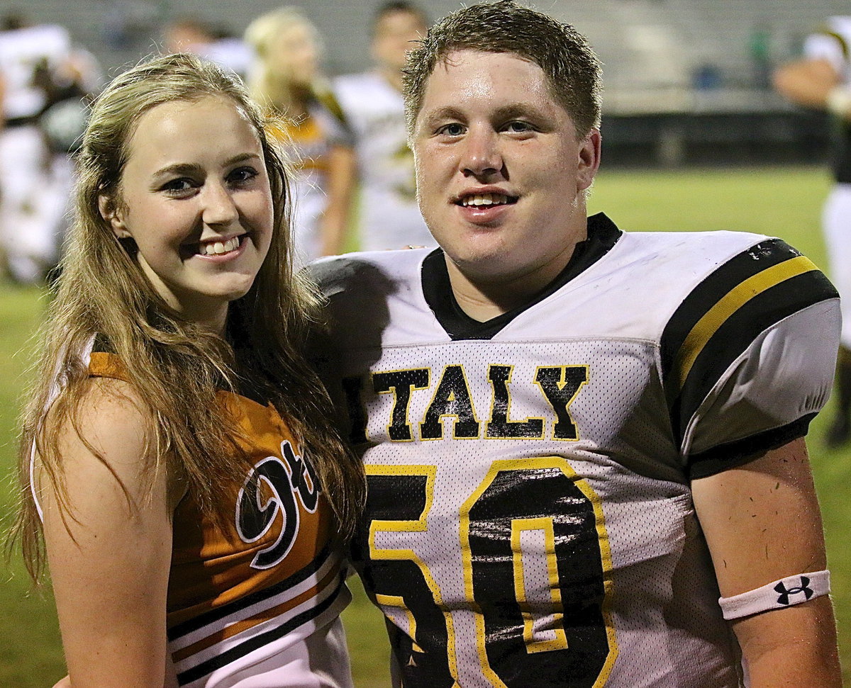 Image: Italy cheerleader Kelsey Nelson congratulates classmate John Escamilla(50) for his tenacious effort!