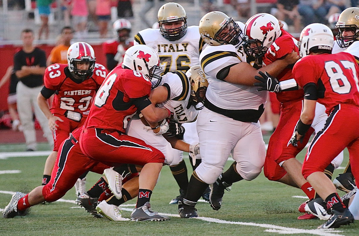 Image: Right offensive guard Ty Fernandez(64) tries to open a running lane but Hunter Merimon(3) is already wrapped up by Panther tacklers.