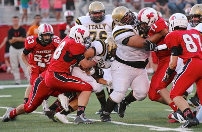 Image: Right offensive guard Ty Fernandez(64) tries to open a running lane but Hunter Merimon(3) is already wrapped up by Panther tacklers.