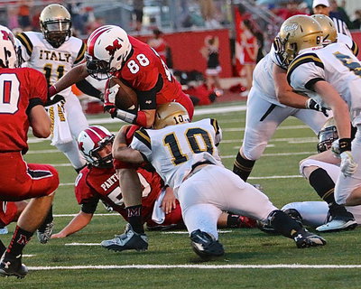 Image: Gladiator inside linebacker Coby Jeffords(10) leg tackles a Panther runner.