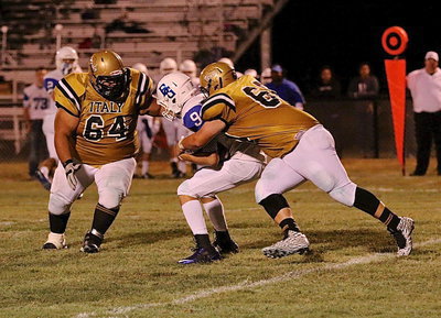 Image: BG’s #9 has no chance as John Byers(60) and teammate Ty Fernandez(64) shutdown a screen pass play attempted by the Lions.