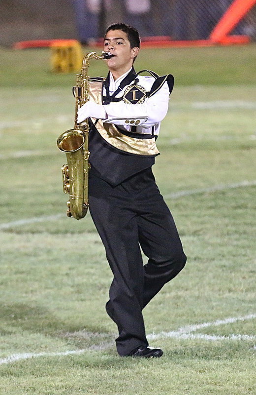 Image: Isaac Garcia is on the move with his portable sax.