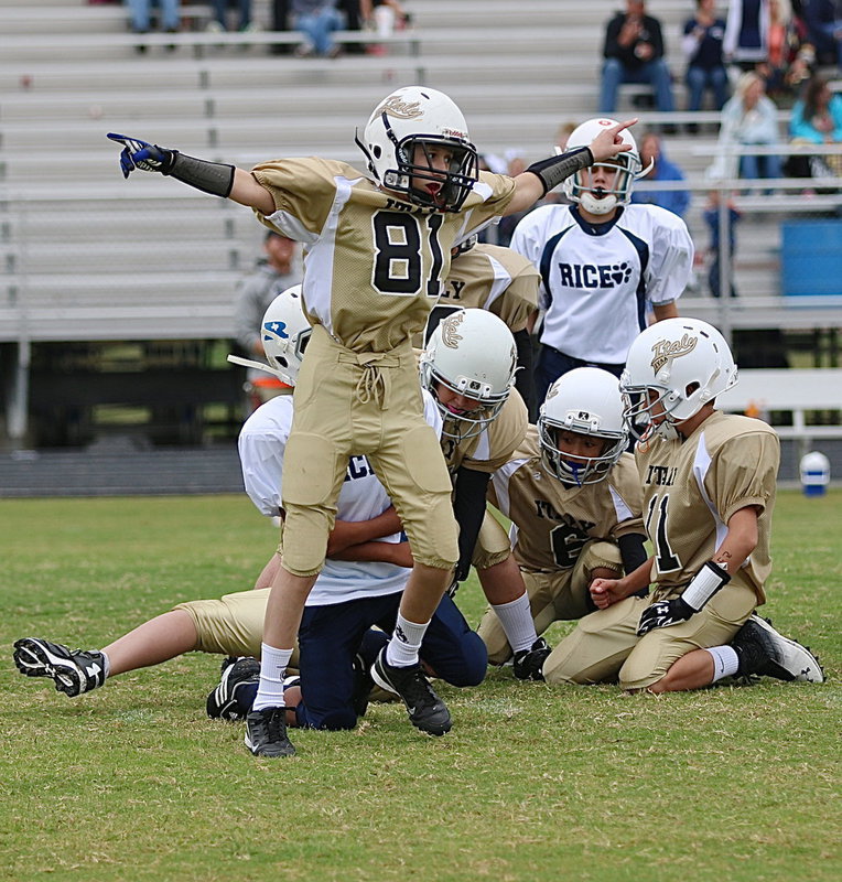 Image: Ty Beets(81) celebrates the onside kick recovery by teammate Daniel Celis.