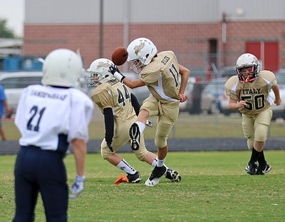 Image: Creighton Hyles(11) kicks off for the A-team Gladiator to start their 2014 campaign as teammates Bryce DeBorde(44) and Aedan Brewer(50) head upfield.