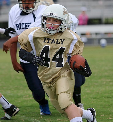 Image: A-team Gladiator Bryce DeBorde(44) looks to score every time he carries the ball.