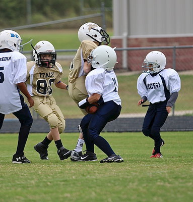 Image: A-team Gladiator Ty Beets(81) crashes into the Rice quarterback to help bring down the Bulldog hurler for a loss.