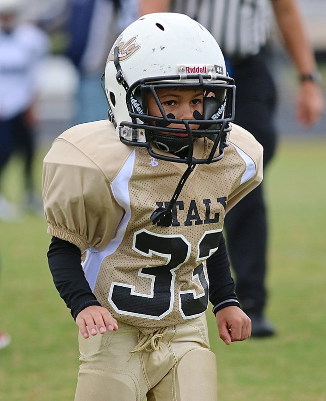 Image: Ramzi Holt(33) exits the field victorious after his C-team Gladiator squad defeated the Rice Bulldogs on opening day.