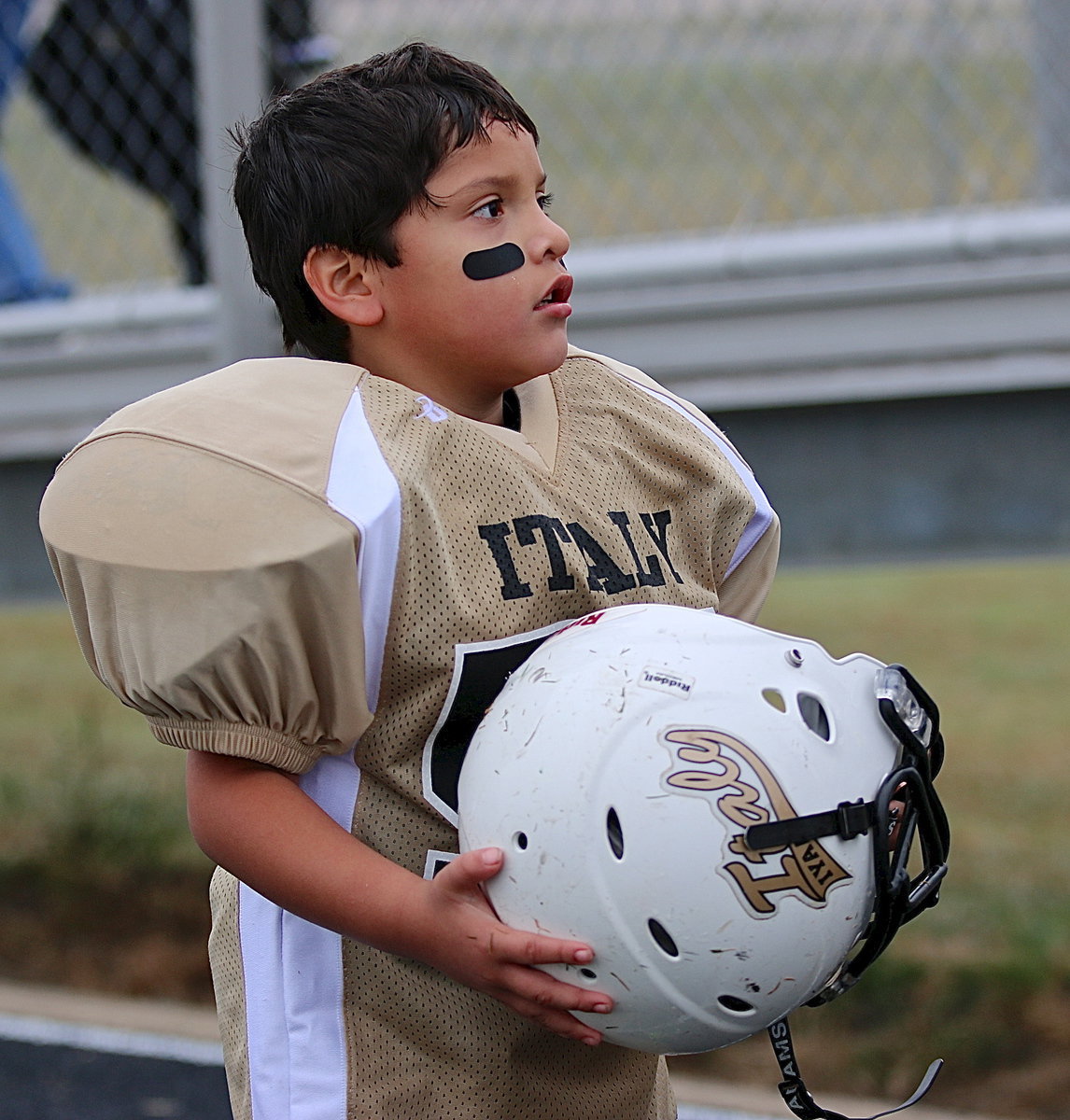 Image: C-team Gladiator Gavin Vasquez(56) looks to the stands for approval from his family after his team’s 20-0 victory over Rice.