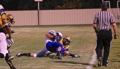 Image: Gladiator safety Ryan Connor(7) makes a tackle along Italy’s sideline.