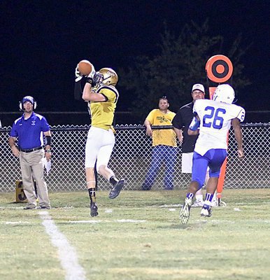 Image: Clayton Miller(6) hauls in a 17 yard pass reception for the Gladiator offense.