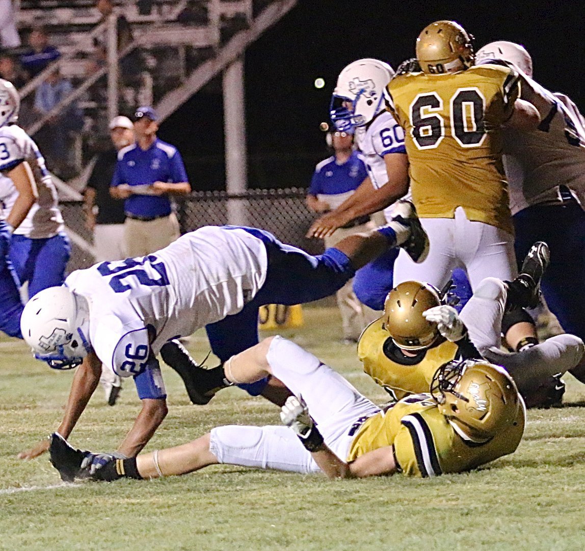 Image: Italy’s Clayton Miller(6) cuts down a Frost defender.
