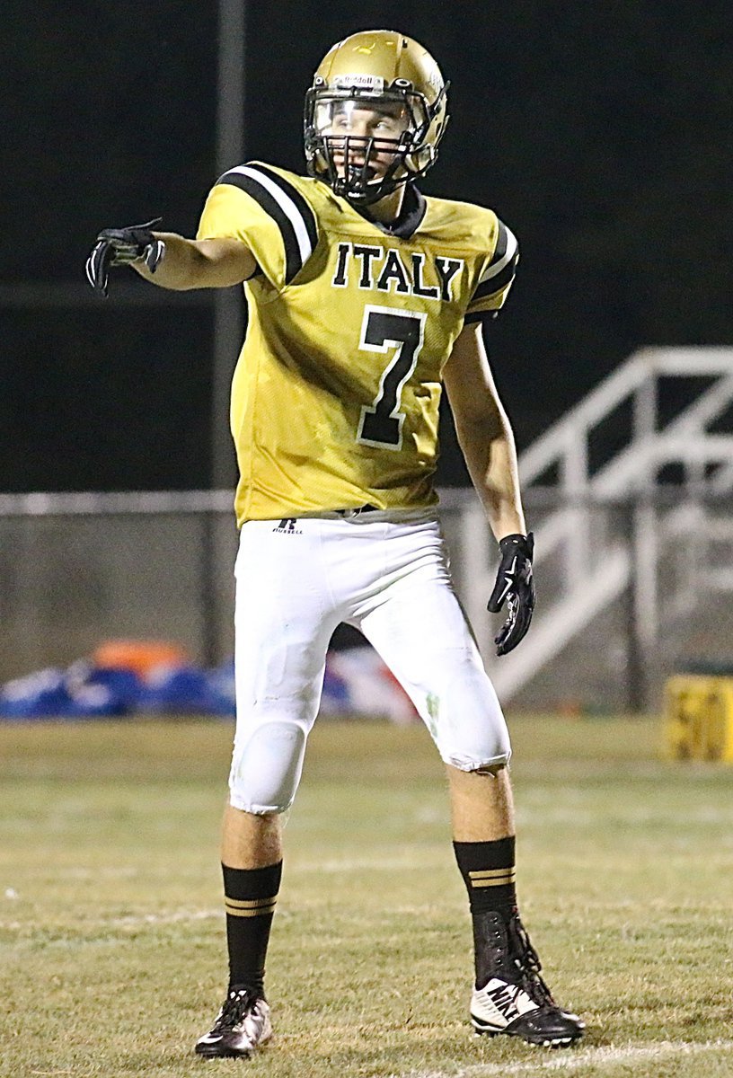 Image: Gladiator Ryan Connor(7) checks with the ref for for alignment before running a pass route.
