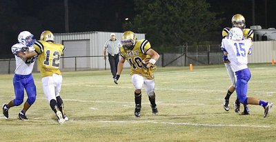 Image: More downfield blocking by Kyle Tindol(12) and Ryan Connor(7) paves the way for Coby Jeffords(10) and another long gainer for the Gladiators.