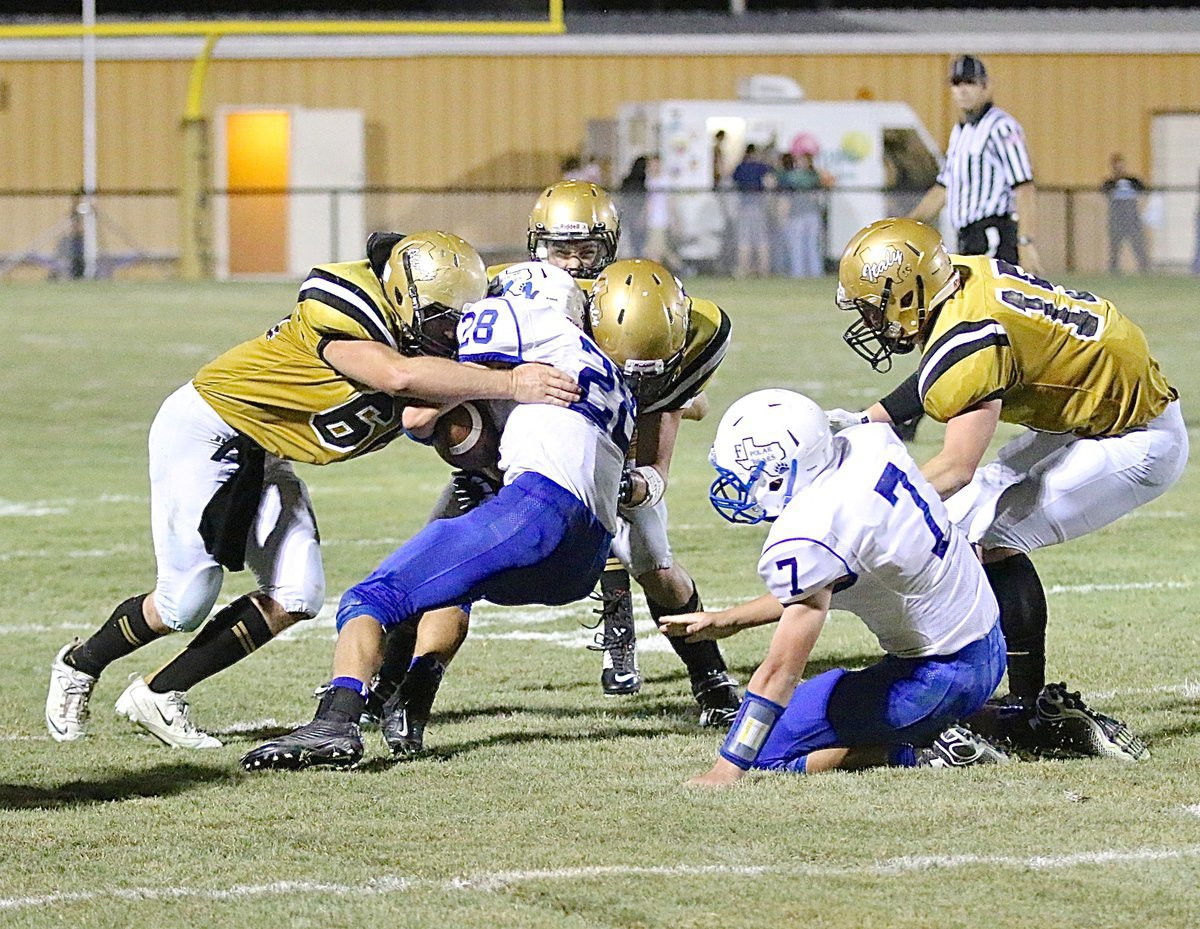 Image: Linebackers Kyle Fortenberry(66) and Coby Jeffords(10) join forces against a Frost runner.